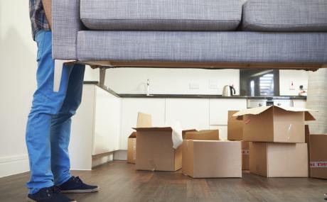 man moving a couch