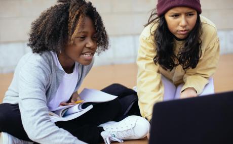 two girls using a computer